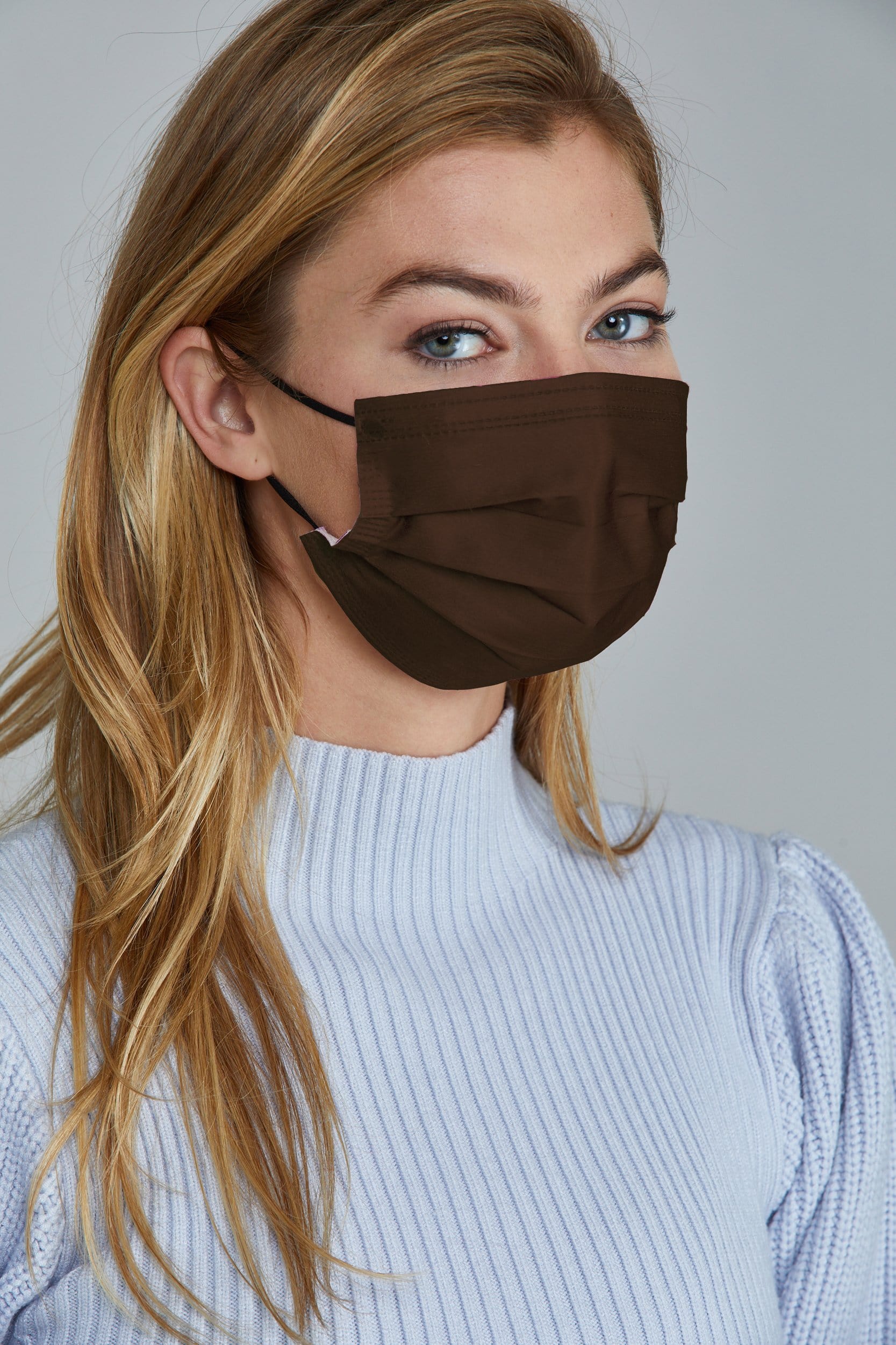 Woman wearing stylish Purple Pleated face mask, with three layers & high quality breathable fabric.