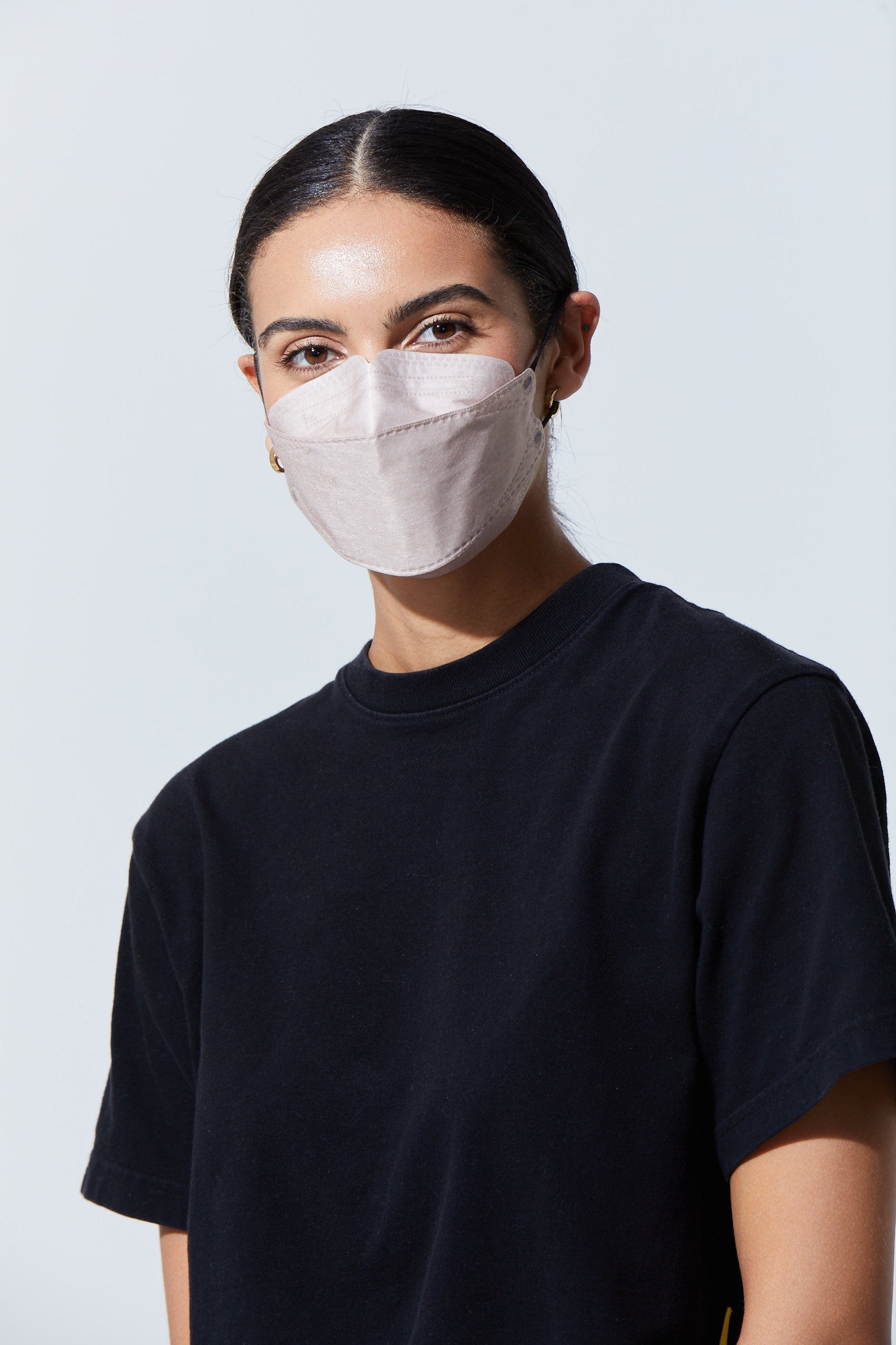Woman wearing stylish Light Brown KF94 face mask, with high quality breathable fabric.