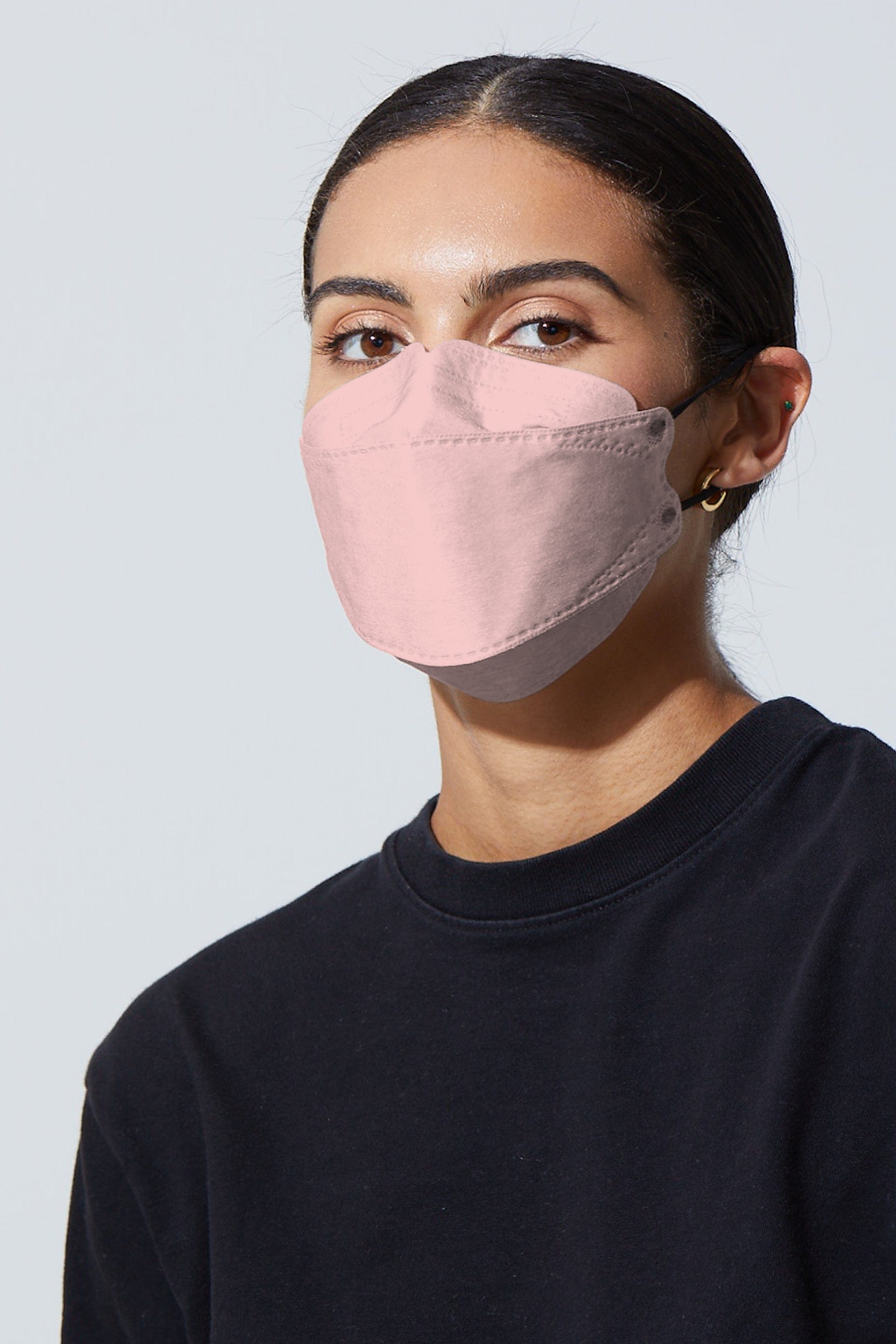 Woman wearing stylish Light Pink KF94 face mask, with high quality breathable fabric.